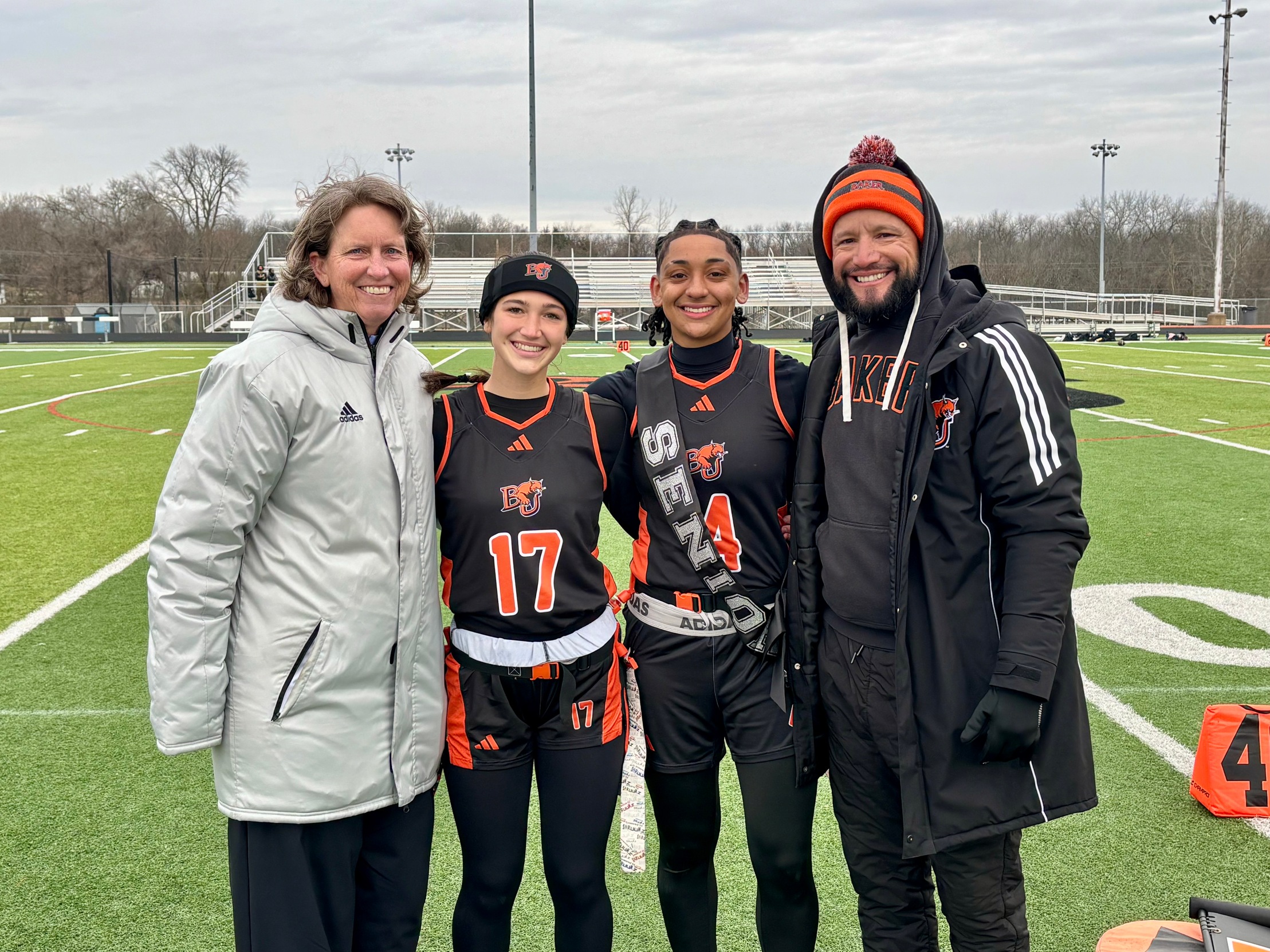 Baker women's flag football senior Kaley Phillips along with Athletic Director Susan Decker, teammate Natalie Busch and head coach Willy Perez
