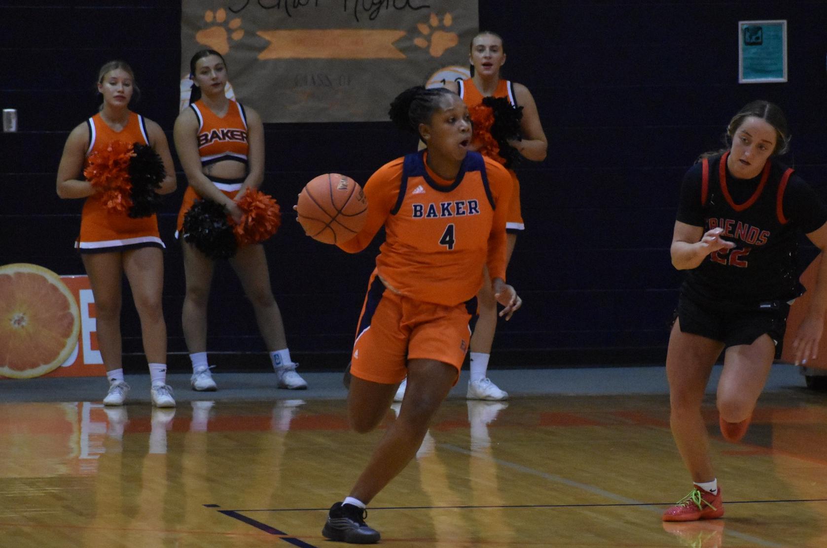 Baker women's basketball senior guard Taniya Tease dribbling at home against Friends