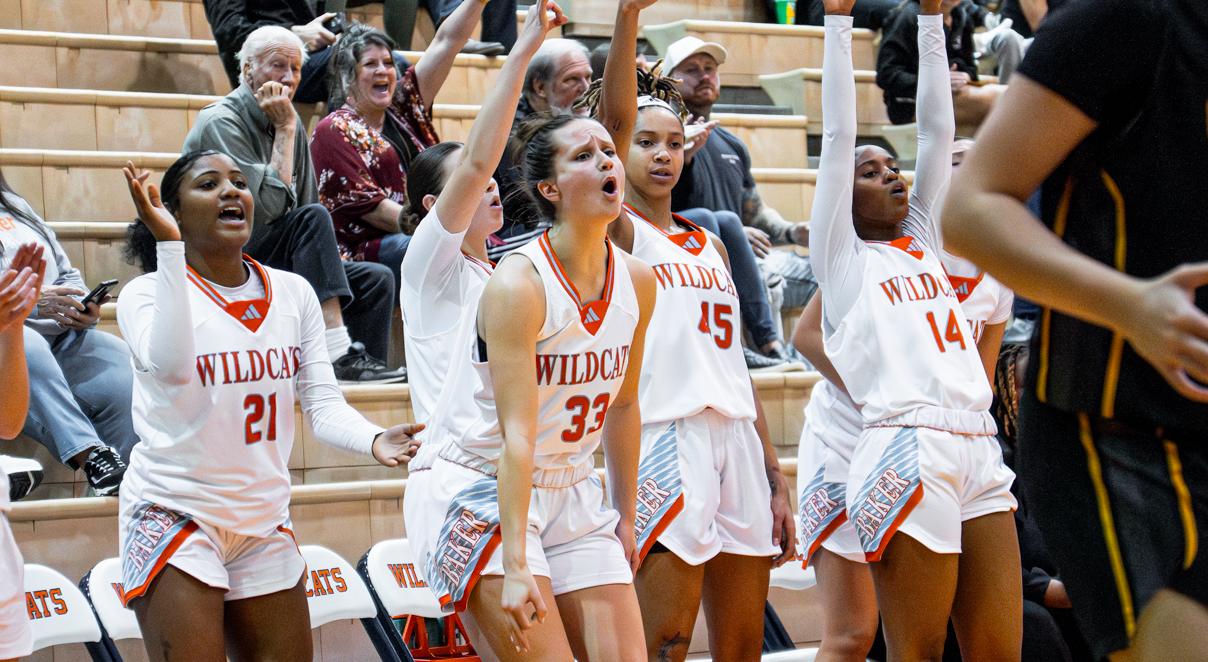 Baker women's basketball bench celebration during home game vs. Ottawa