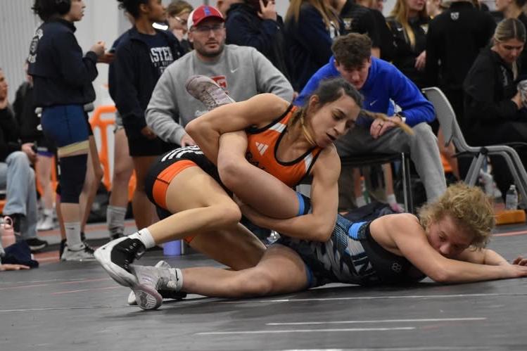 Kylie Robledo wrestling legs of opponent at Warrior Open.
